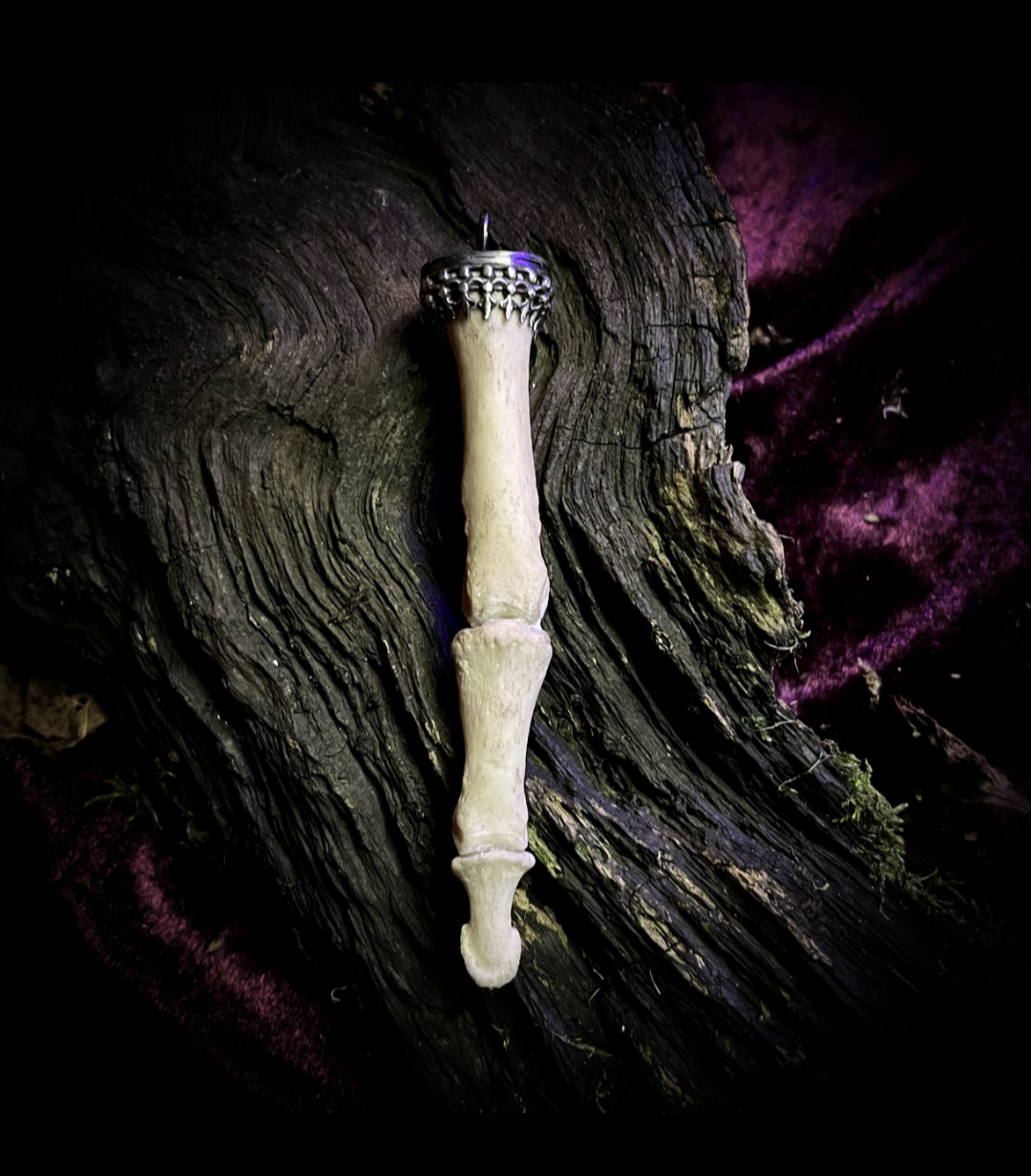 Human bone and sterling silver finger pendant